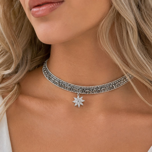 Sparkle Flower Choker Necklace worn by a  woman featuring a silver crystal flower pendant and sparkling rhinestone choker.
