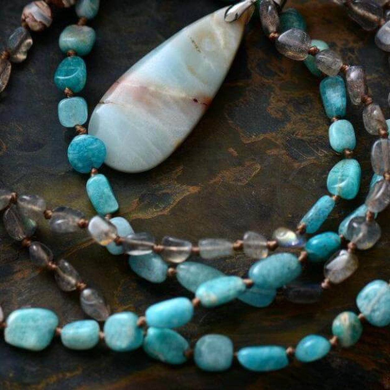 Close-up of the Spirit Stone Beaded Necklace highlighting the natural stone pendant, turquoise gemstone beads, and handcrafted details.
