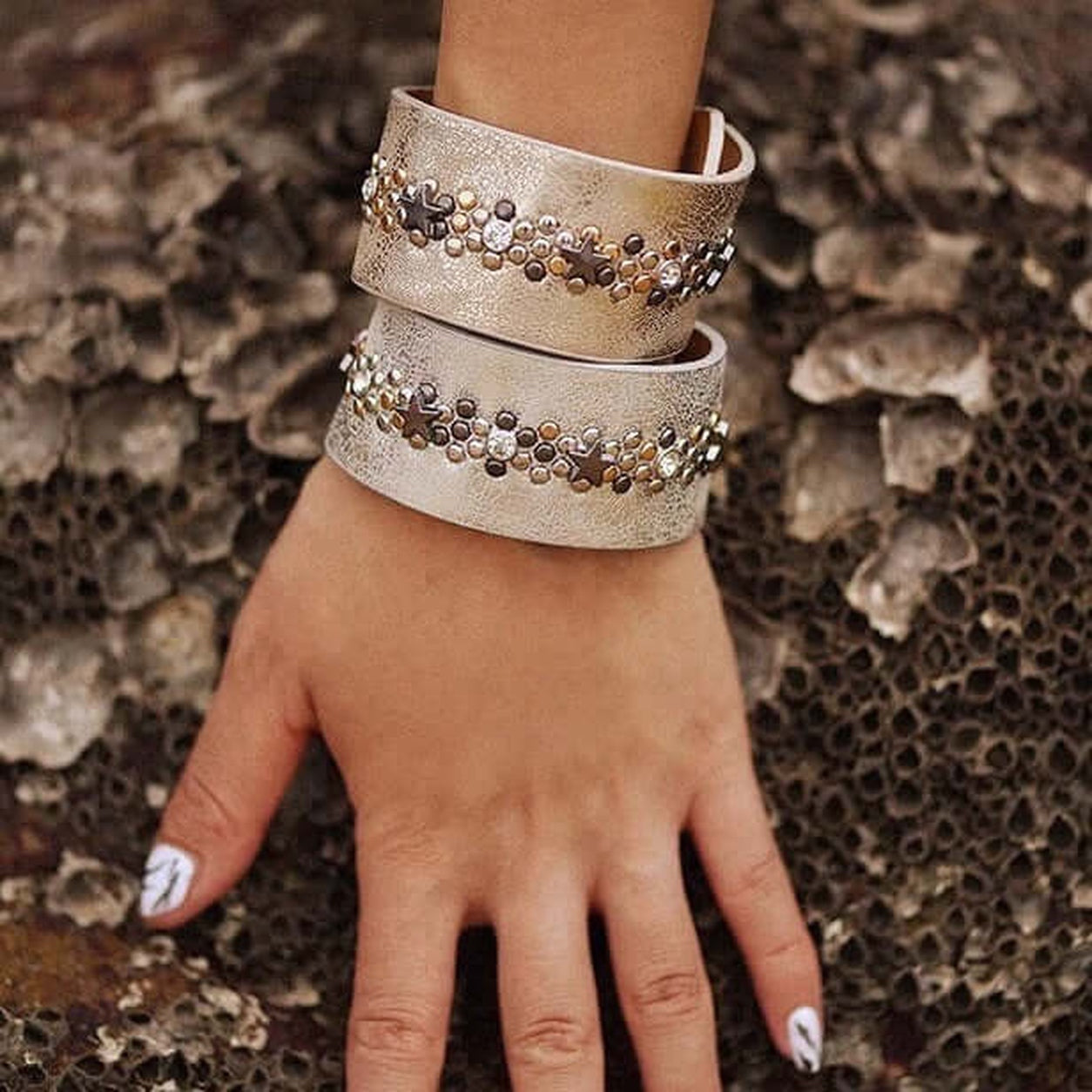 Star Charm Cuff Bracelet Set worn outdoors, featuring sparkling crystal accents and silver star embellishments.