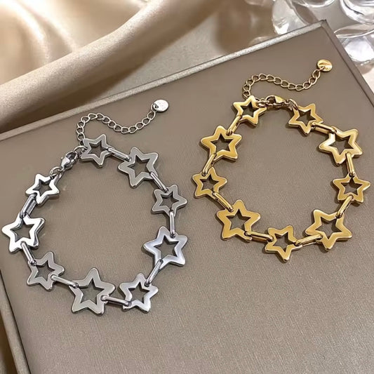 Star Link Chain Bracelet in gold and silver finishes displayed together with hollow star-shaped links.