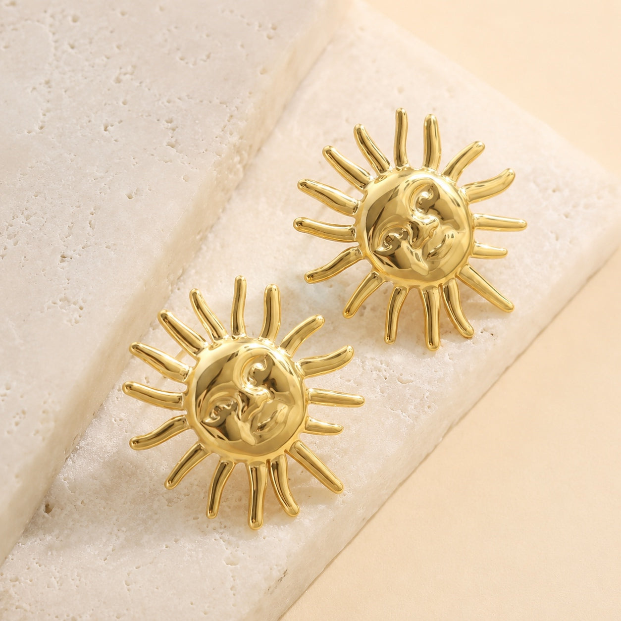 Gold Sun Goddess Stud Earrings featuring a polished celestial sun face with radiant rays.
