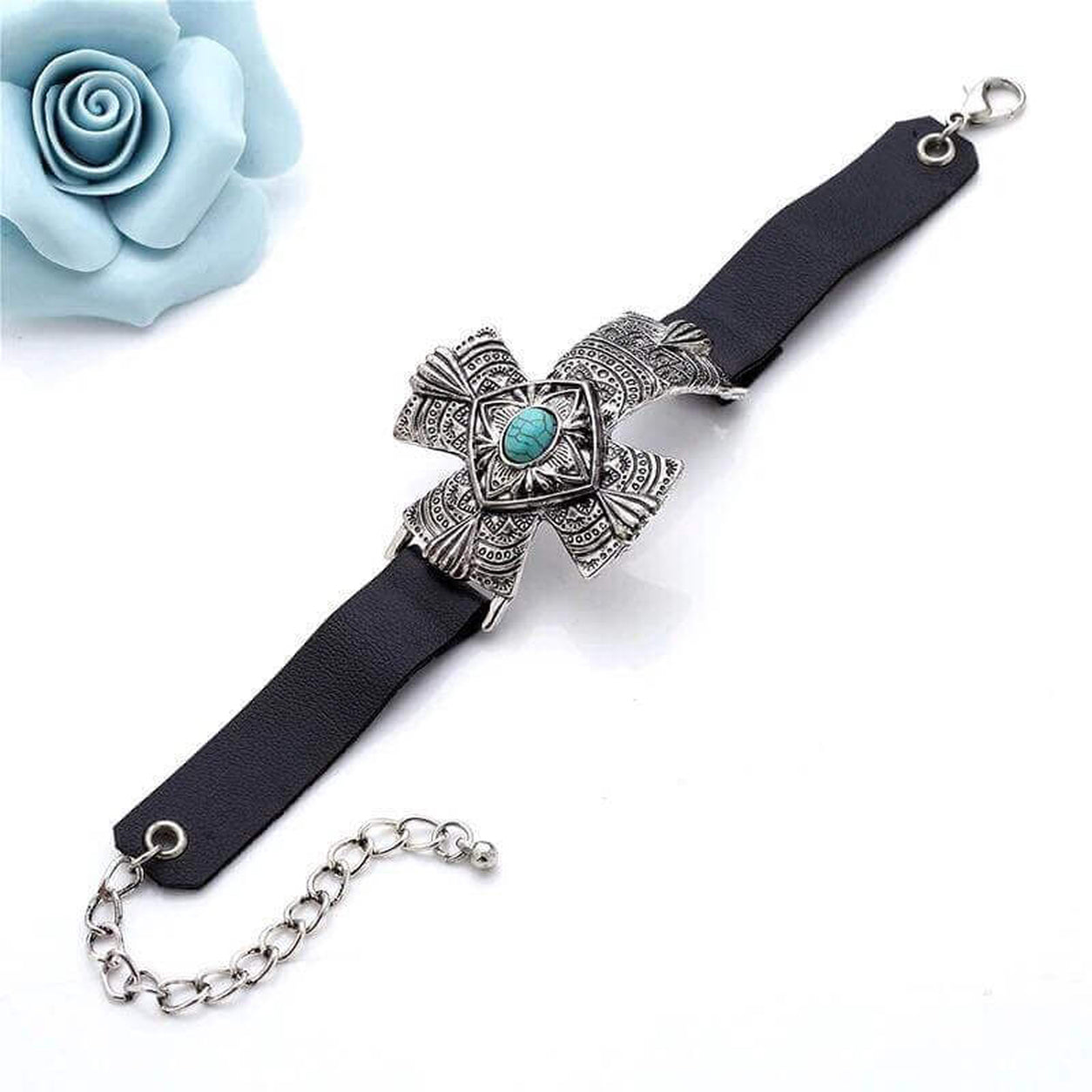 Full view of the Turquoise Cross Statement Bracelet with engraved silver cross, turquoise stone, black leather band, and adjustable chain clasp.