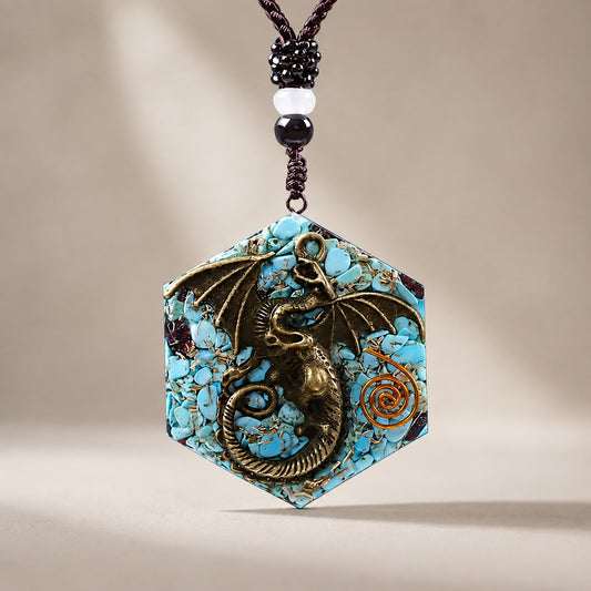 Turquoise Dragon Pendant Necklace featuring an antique bronze dragon set in a handcrafted hexagon resin pendant with turquoise stone chips.