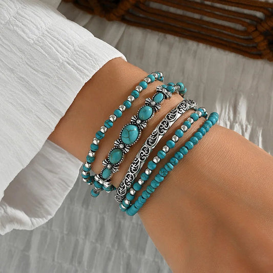 Turquoise Treasure beaded bracelet set worn on wrist with turquoise beads and ornate silver-tone accents