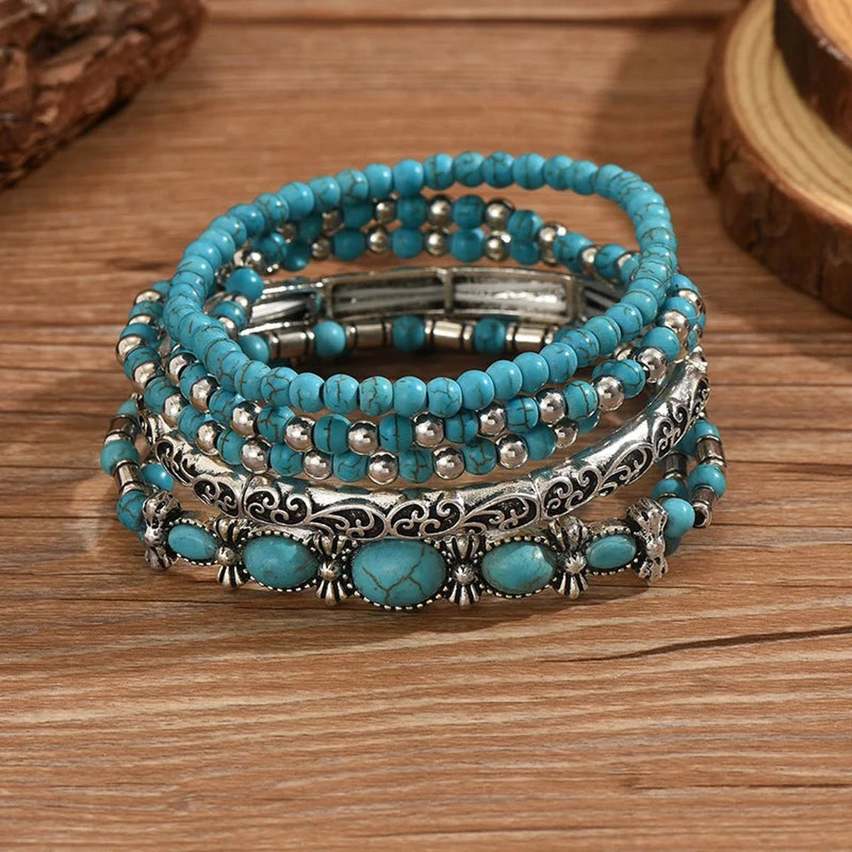 Five-piece turquoise beaded bracelet set with silver-tone beads and decorative southwestern designs