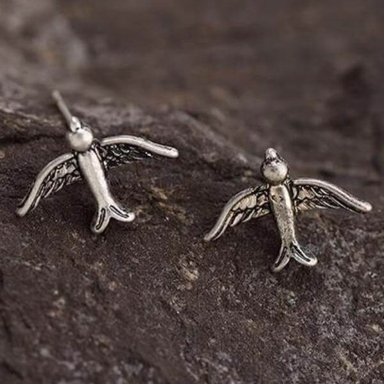 Close-up of Vintage Silver Bird Stud Earrings with antique silver finish and detailed feather wings.